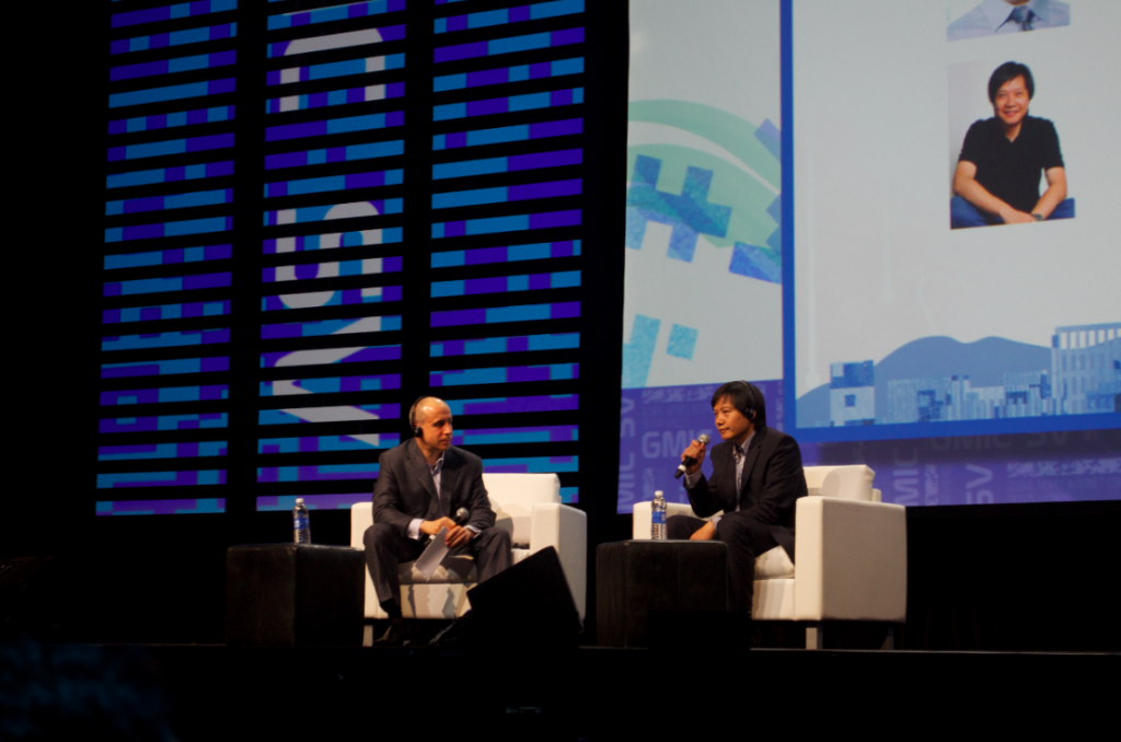 Yuri Milner and Lei Jun (right) at the Global Mobile Internet Conference in Silicon Valley. (Ryan Mac/Forbes)